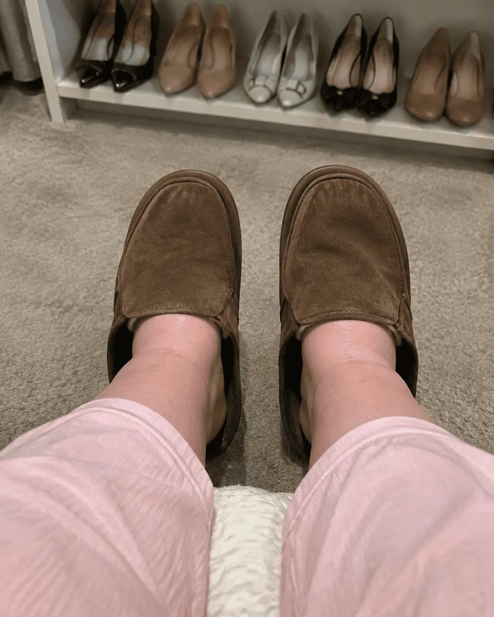 Swollen feet in oversized men's slippers